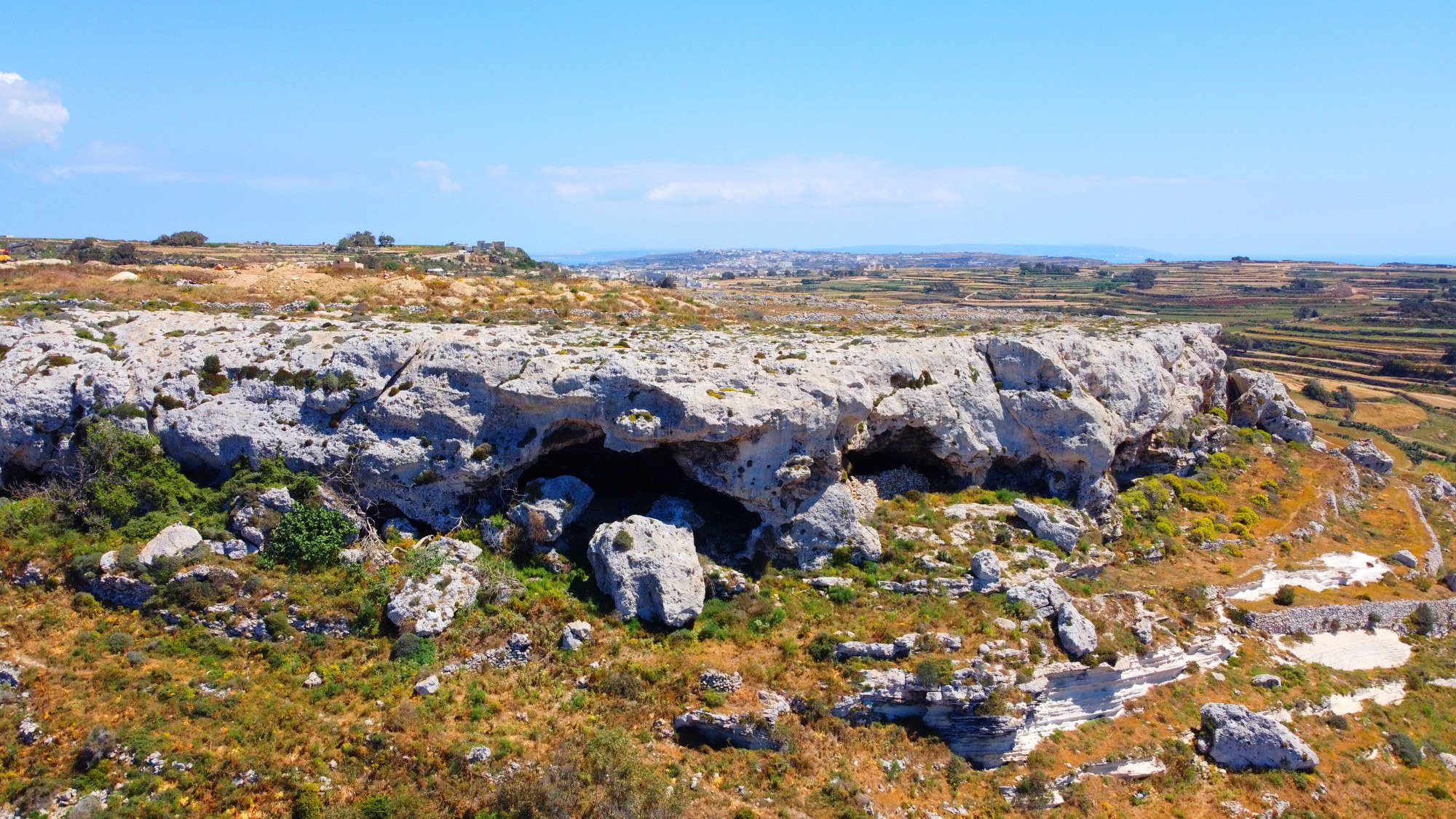 The limestone caves of San Lawrenz set against the surrounding countryside